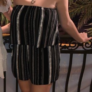 Strapless black romper with gold and white pattern
